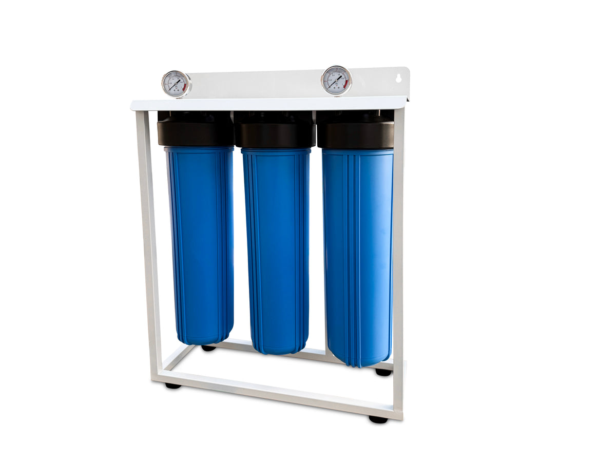 Three blue 20-inch jumbo filter housings in a white frame with two pressure gauges